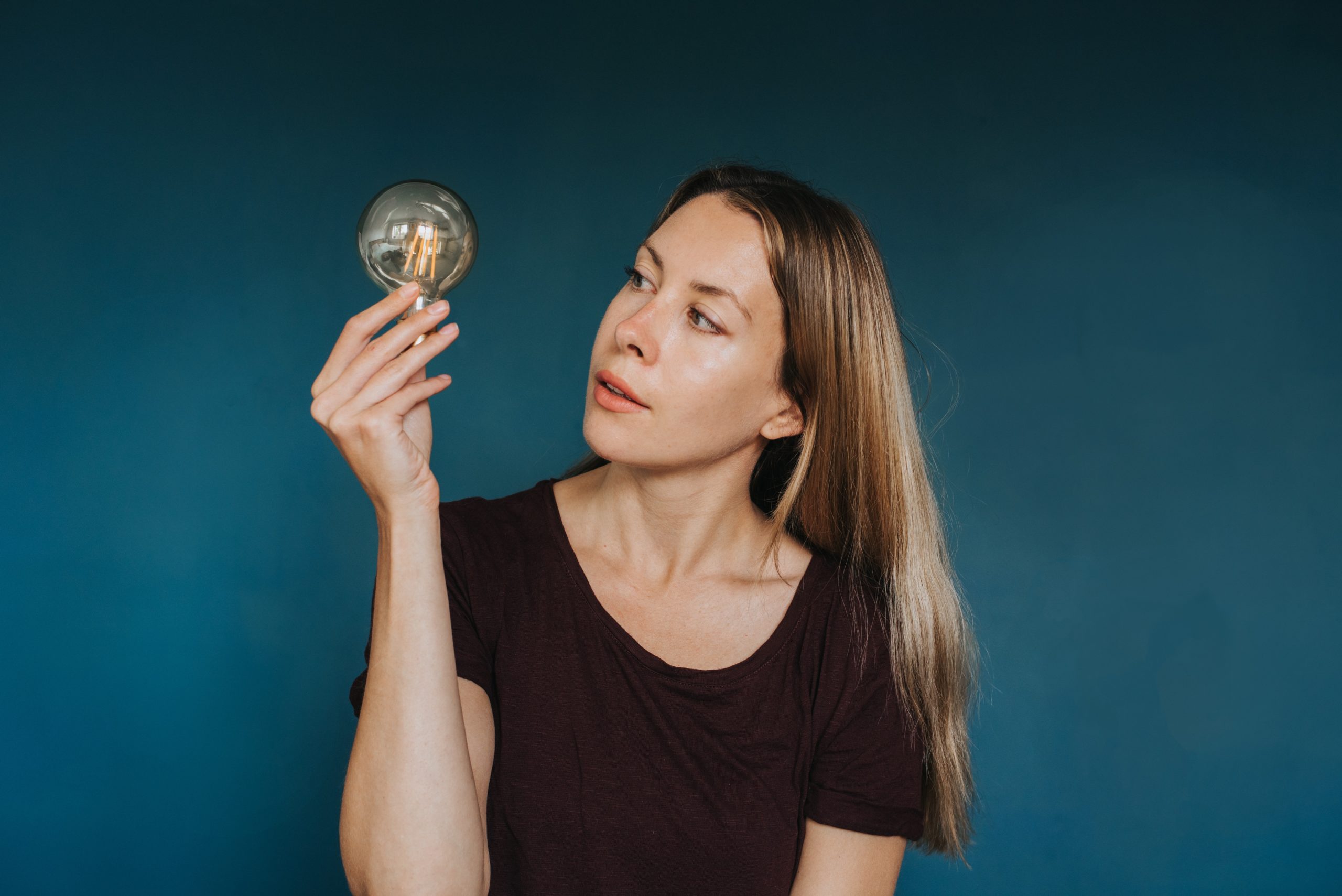 Successful product launch idea: woman holding a lightbulb