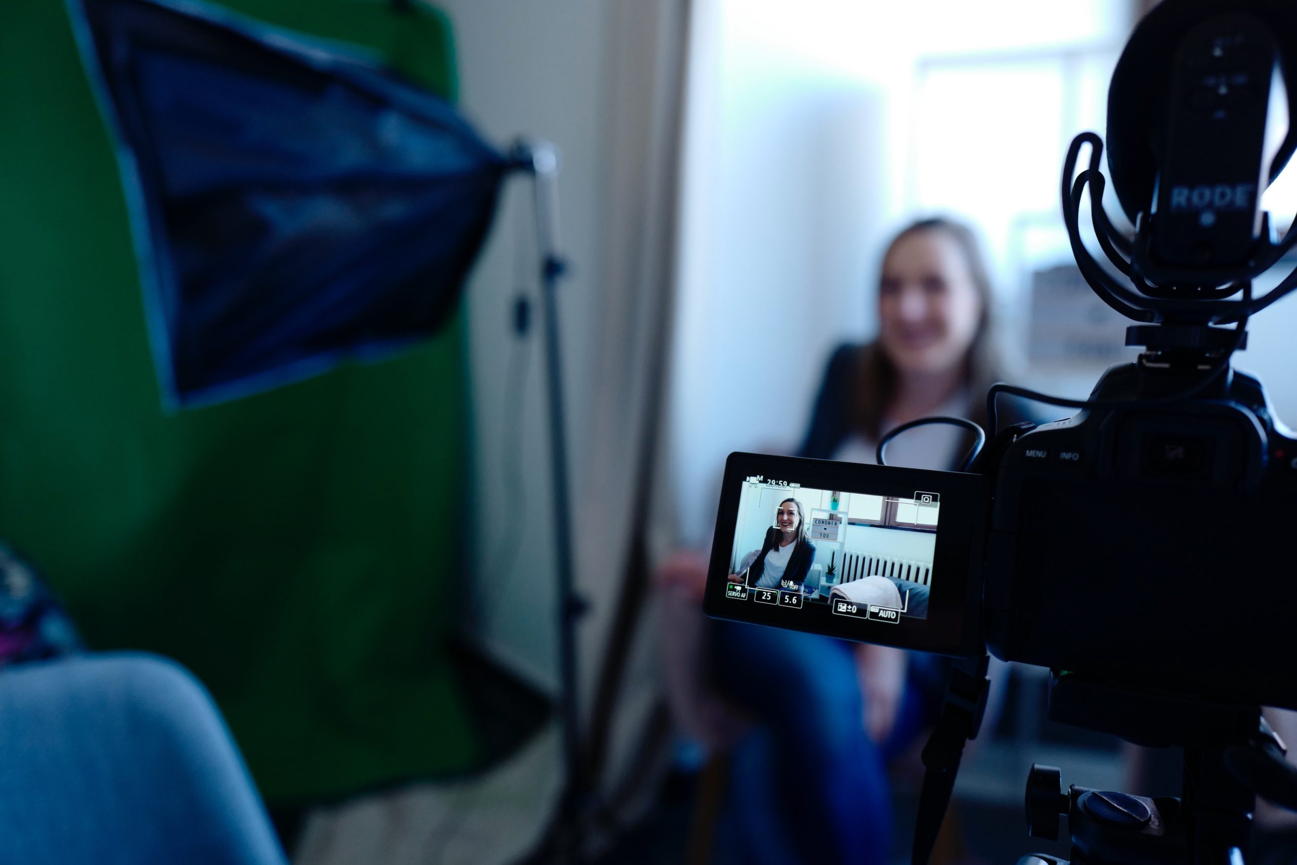 Businesswoman being filmed on a video camera - why video content is important